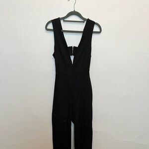 Black sleeveless jumpsuit with cutouts